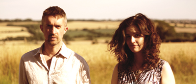 A photo of Rob and Corinne in a field